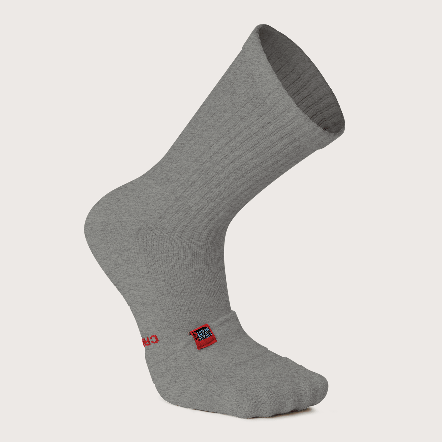 Single gray Crease Beast crew sock with a red brand tag on the side, angled on a white background.