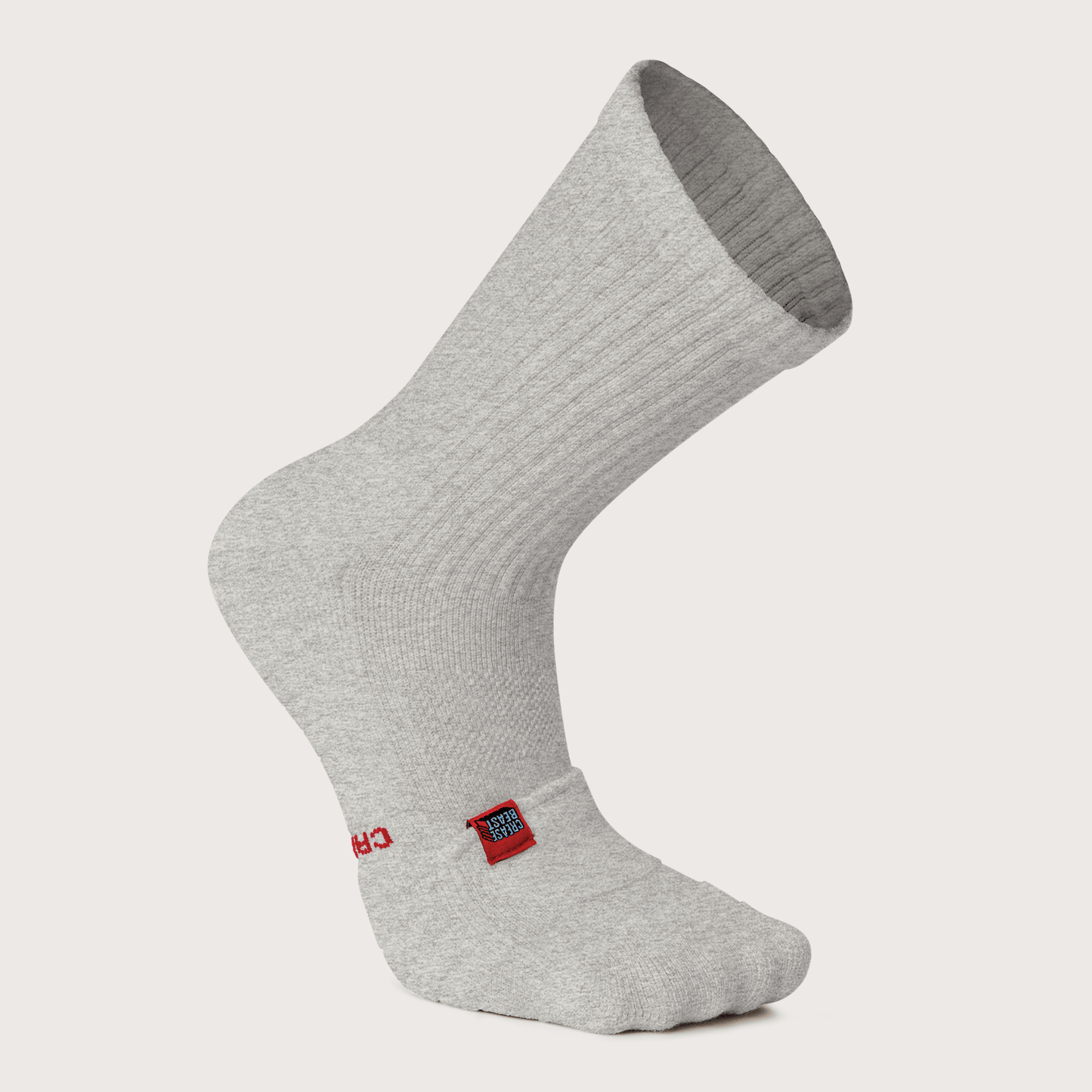 Front view of a single light gray Crease Beast Pocket Crew Sock with a red and blue tag on the ankle.