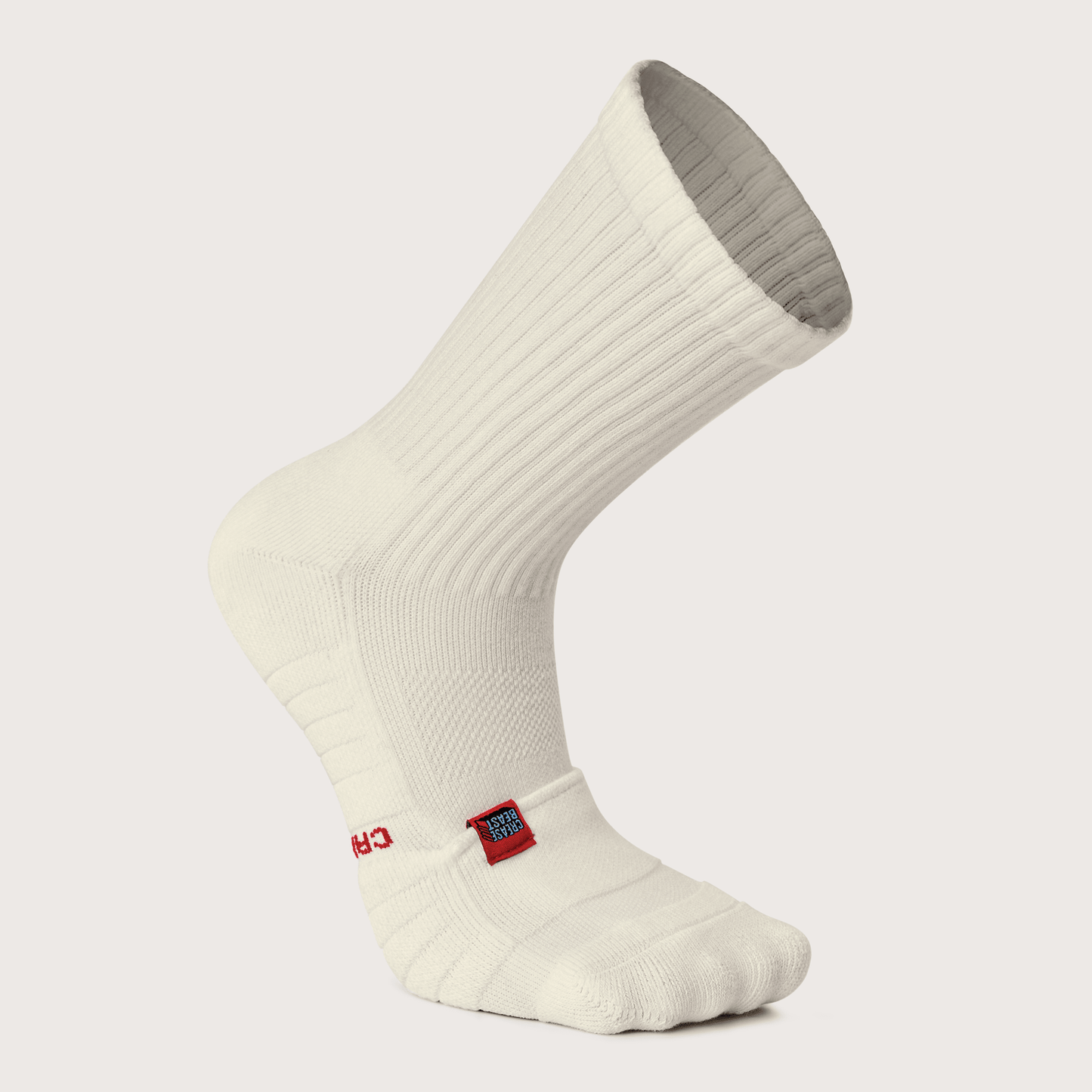 CREASE BEAST POCKET SOCKS - CREW, a single white crew sock with a red "CREASE BEAST" tag, side view.