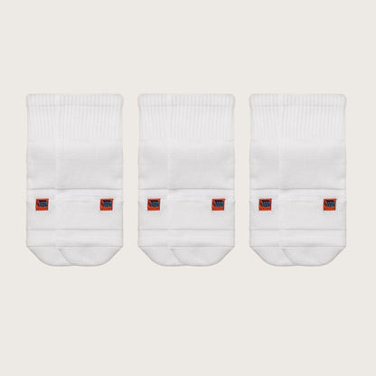 Three pairs of white Crease Beast Pocket Socks - Ankle, each with an orange Crease Beast label.