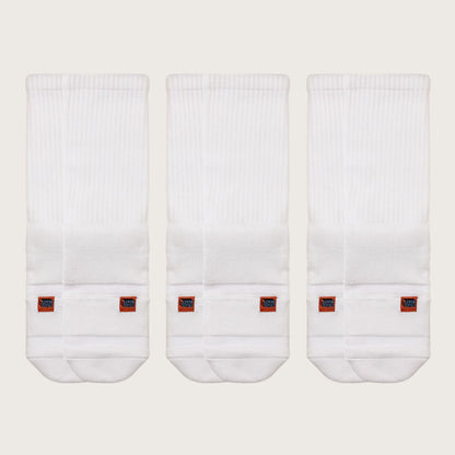 Three pairs of white Crease Beast Pocket Socks - Crew, each with an orange Crease Beast label.