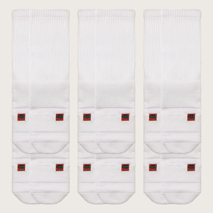 Three pairs of white Crease Beast Crew Pocket Socks, each with two orange Crease Beast brand tags.