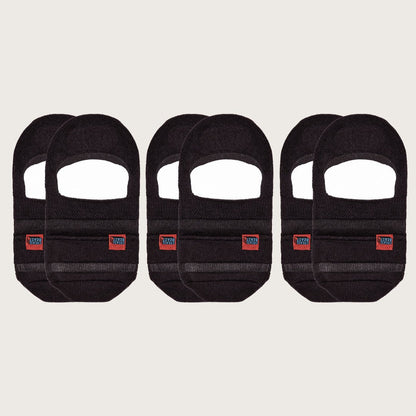 Six black Crease Beast No Show Pocket Socks, each with a red and blue brand label, front view.